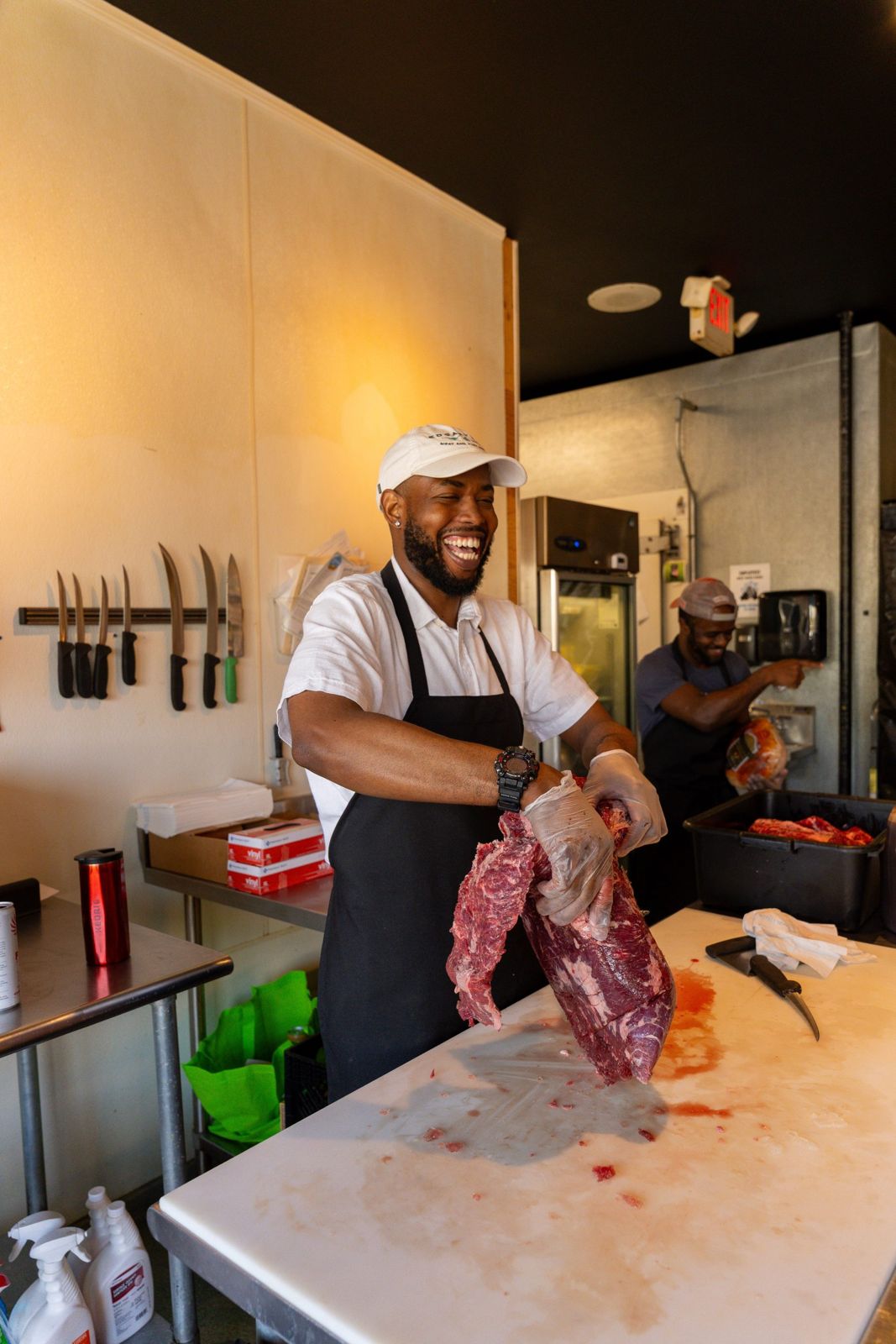 Butcher cutting meat